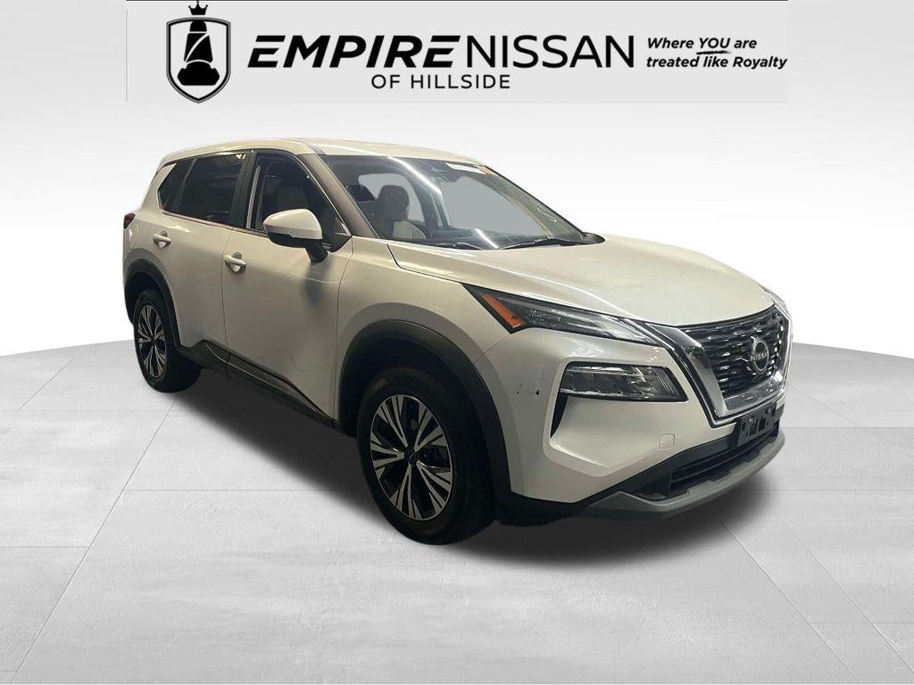 2023 Nissan Rogue SV in Pearl White Tricoat — front three-quarter view